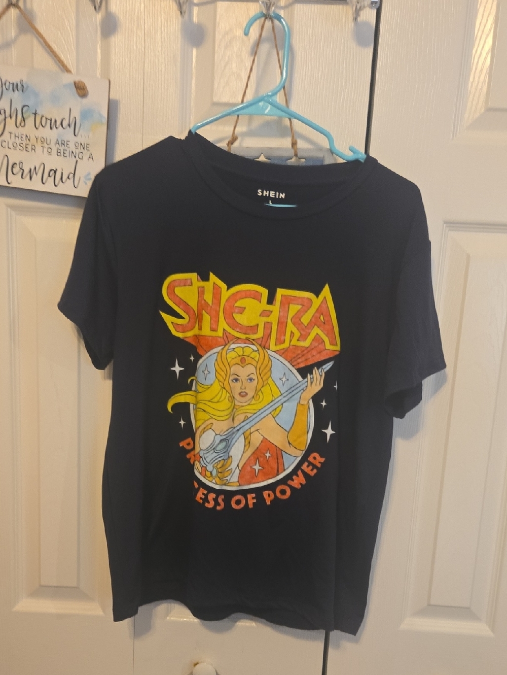 SHEIN Black She‑Ra Graphic Tee with Yellow & Red Print
